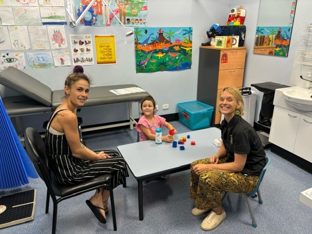 DDHS staff meet with mum and child in the Danggal Dalby (Strong Kids) meeting room at Palmerston Clinic.