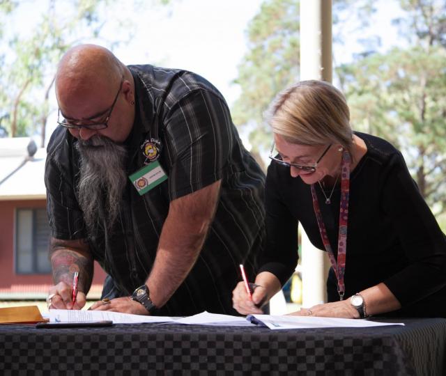 Danila Dilba acting CEO Malcolm Darling and CAAPS CEO Jill Smith signing of the  MOU agreement between Danila Dilba and CAAPS